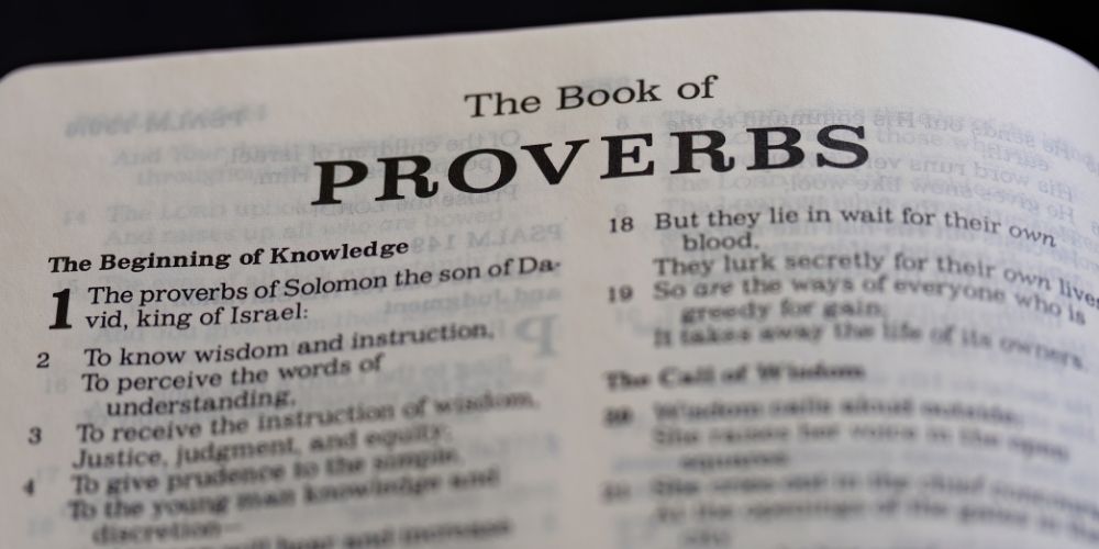 A Bible that is opened to the book of Proverbs.