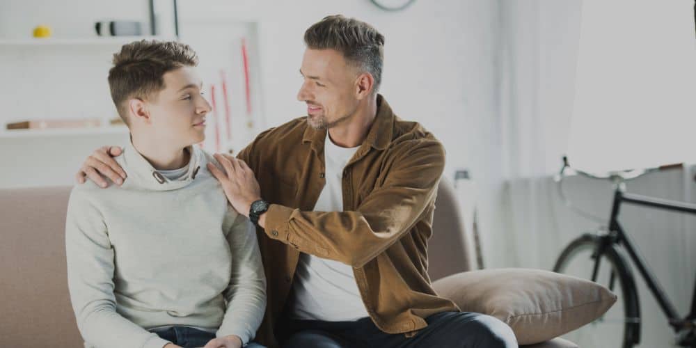 man with kids; disciplining a child who won't listen
